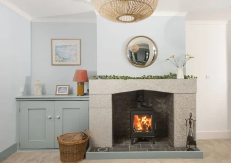 The cosy snug, with wood-burning stove, at Westaway House, Trelights