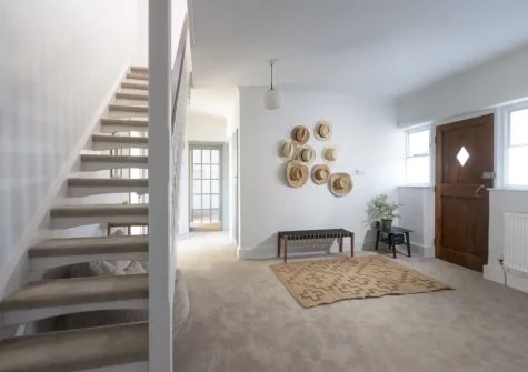 The entrance hall & stairs up to the first floor at Westaway House, Trelights