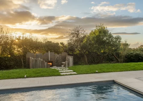 The swimming pool & outdoor wood-burning stove & sitting area at Westaway House, Trelights