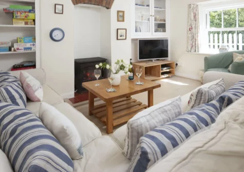 Westover Cottage, St Mawes, is a charming three-bedroom retreat formed from two historic cottages, just moments from the harbour. Enjoy two cosy sitting rooms, a sun-drenched terrace and sea views, perfect for families exploring Cornwall.