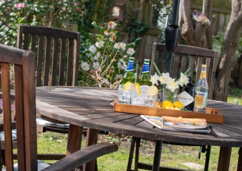 The south-facing enclosed garden with barbecue & alfresco dining area at Westover House, Croyde