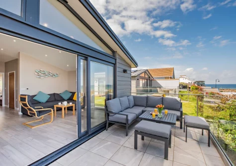 The patio & outdoor sitting area at Westward Home!, Westward Ho!