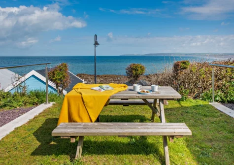 The shared lawn & alfresco dining area at Westward Home!, Westward Ho!