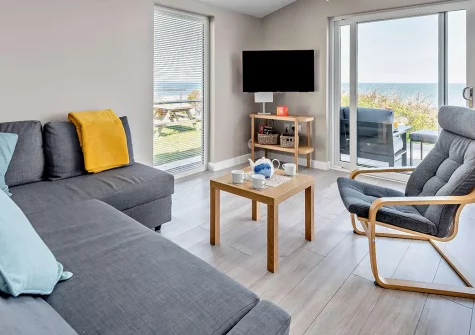 Westward Home!, Westward Ho! is a stylish 2-bedroom seafront cottage with panoramic ocean views, contemporary interiors, and a private balcony. Enjoy direct beach access and water sports. Perfect for families seeking a memorable North Devon escape.