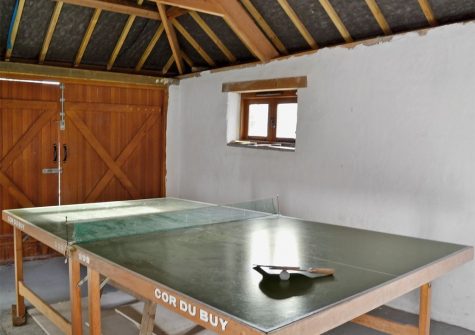 The shared games room at What a Beauty, Higher Churchtown Farm, Tresmeer