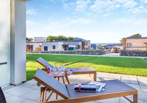 The ground-floor patio & garden at White Dunes, Constantine Bay