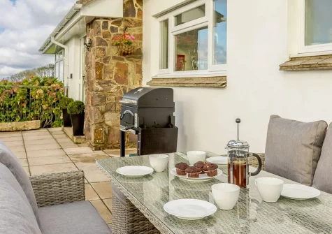 The patio, barbecue & alfresco dining area at Whitestone Farm, Lee