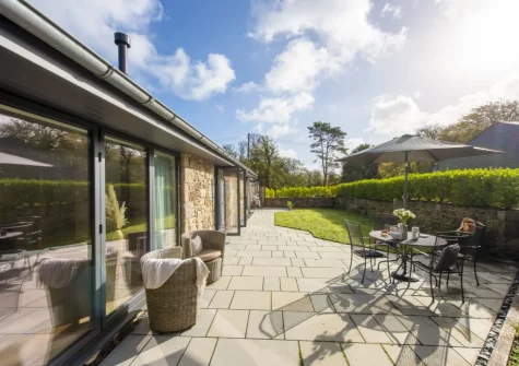 The patio, alfresco dining, outdoor sitting area & enlosed garden at Whitewood, Carnhell Green