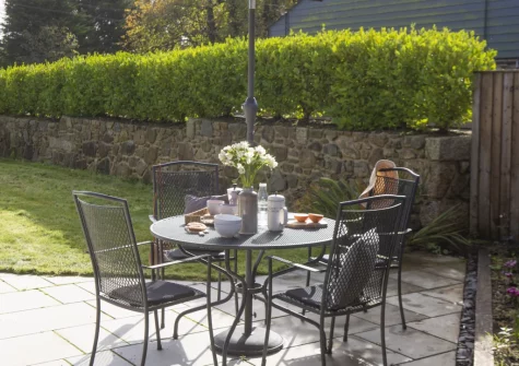 The patio, alfresco dining area & enlosed garden at Whitewood, Carnhell Green