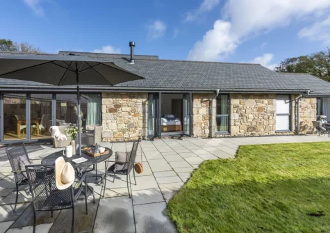 The patio, alfresco dining, outdoor sitting area & enlosed garden at Whitewood, Carnhell Green