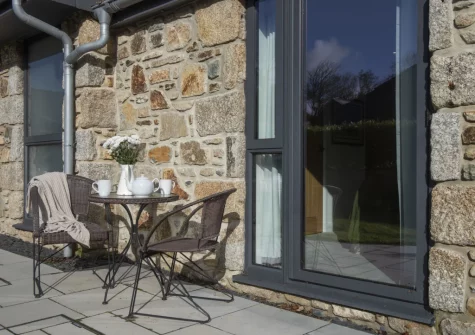 The patio & outdoor sitting area at Whitewood, Carnhell Green