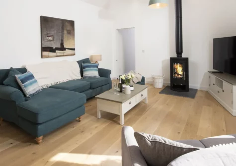 Whitewood, Carnhell Green is a luxurious eco-friendly barn conversion with an enclosed garden, wood burning stove and three stylish bedrooms, sleeping six guests and two dogs amid peaceful west Cornwall countryside close to Hayle and St Ives.