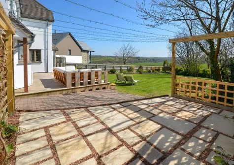 The decked patio, outdoor sitting area & garden at Wildwood, Bude