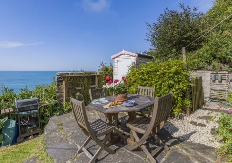 The patio, barbecue, alfresco dining area & garden at Williams Cottage, Buck's Mills