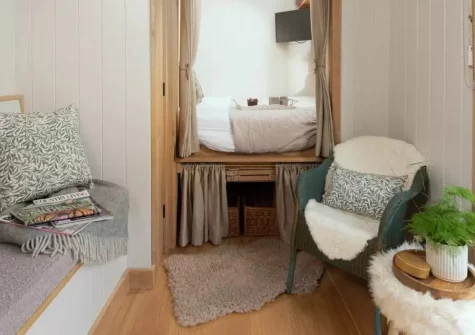 Willow at Devon Heaven Hideaways, Kenn is a secluded Devon shepherd's hut with a private hot tub, pizza oven, and log burner. Enjoy river views, stargazing skylights, and easy reach of Dartmoor, Exeter, and the coast for a peaceful rural escape.