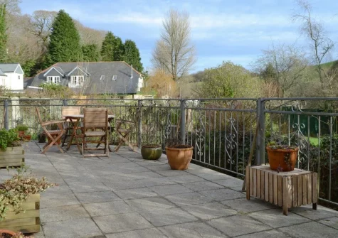 The large patio & alfresco dining area at Willow Barn, Polmassick
