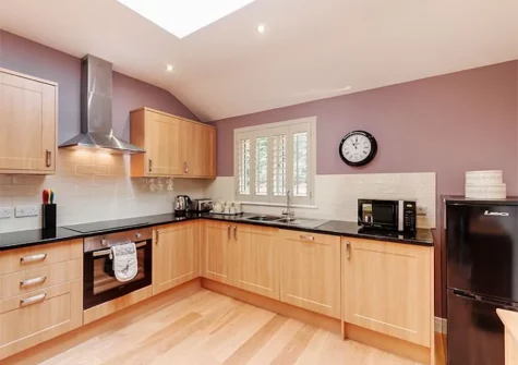 The kitchen at Willow Lodge, South View Lodges, Shillingford St George