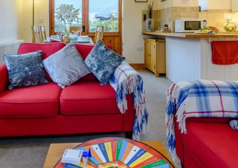 Windbury Barn, Hartland is a charming 3-bedroom barn conversion with exposed beams, a wood burner, and a spacious garden with views over the fields. Perfectly placed for coastal walks, countryside adventures, and exploring picturesque North Devon.