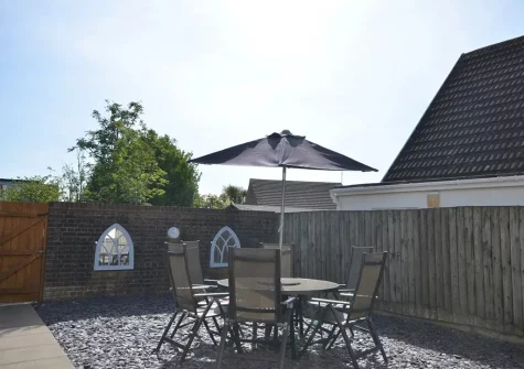 The patio & alfresco dining area at Windward Cottage, Hillhead