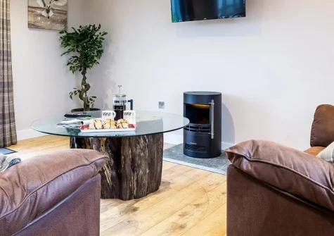 Windwhistle Lodge, South Molton is a charming two-bedroom countryside retreat featuring a private hot tub and breathtaking rural views. Explore 70 acres of working farmland, enjoy river fishing, and discover North Devon's beautiful golden beaches.