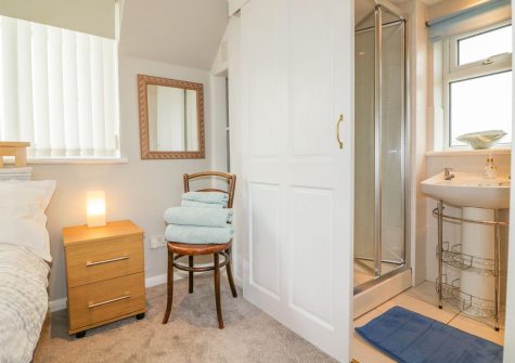 The bedroom & en-suite at Wisteria Cottage, Exmouth