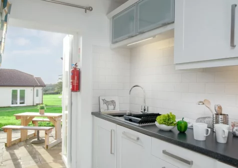 The kitchen at Wonkey Donkey Cottage at Stoneleigh Holiday Village, Weston