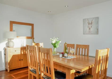 The dining area at Wonkey Donkey Cottage at Stoneleigh Holiday Village, Weston