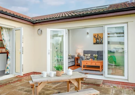 The patio & alfresco dining area at Wonkey Donkey Cottage at Stoneleigh Holiday Village, Weston