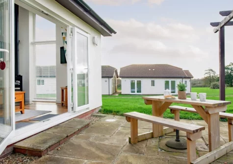 The patio & alfresco dining area at Wonkey Donkey Cottage at Stoneleigh Holiday Village, Weston