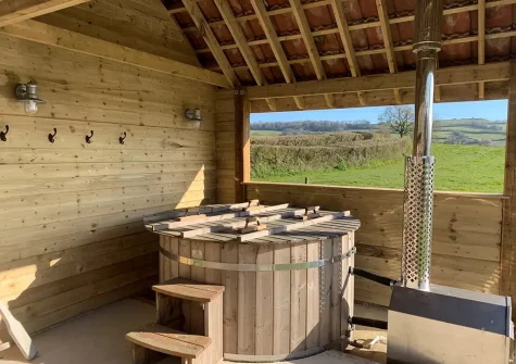 The Scandinavian style log fired hot tub at Wonover, Musburry