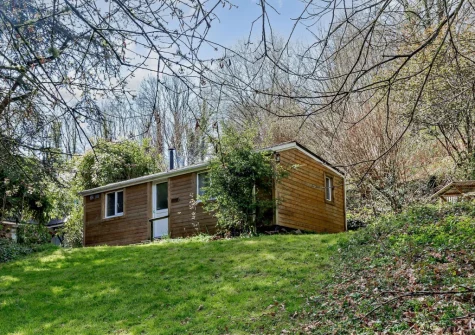 Woodcutters Cottage is situated in a beautiful tranquil woodland valley at Greatrock Farm on the outskirts of Hennock village