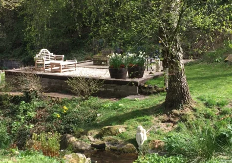 Enjoy use of the shared outdoor spaces when you stay at Woodcutters Cottage at Greatrock Farm, Hennock