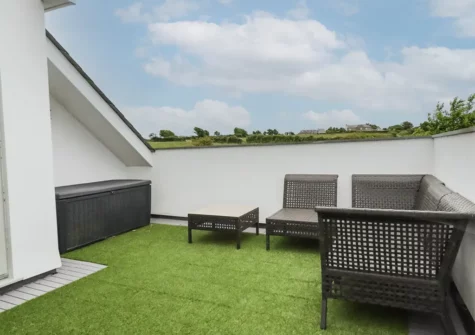 Relax on the private terrace accessed from bedroom #1 at Woodlands Close, Treator