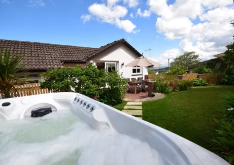 The hot tub & large enclosed garden at Woodside, Westward Ho!