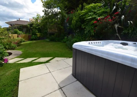 The hot tub & large enclosed garden at Woodside, Westward Ho!