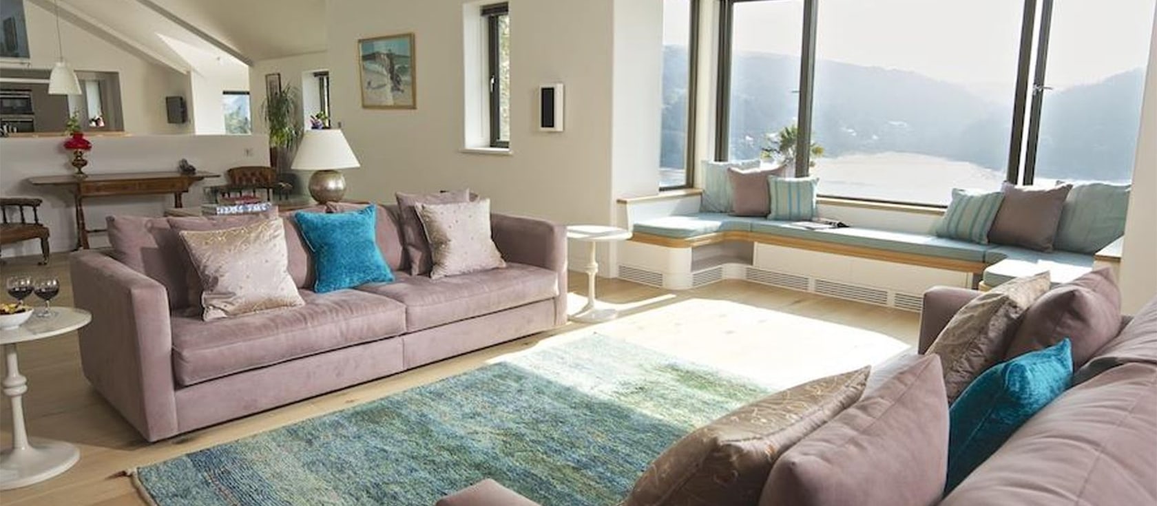 Woodwell, Salcombe is a contemporary classic four bedroom house for eight with stunning estuary views from the bedrooms and deck. Open plan living room and gourmet Bulthaup kitchen are marks of the award-winning architects. Games room & parking.