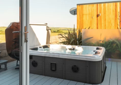 The secluded decked patio & hot tub at Woolacombe Retreat, Hillview, Mullacott