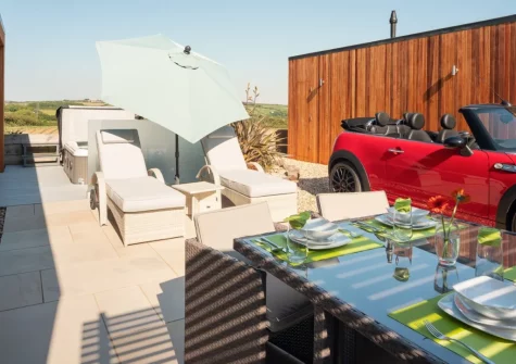 The patio, alfresco dining & outdoor sitting area at Woolacombe Retreat, Hillview, Mullacott