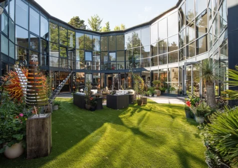 The atium has a lush botanical atmosphere to enjoy day & night