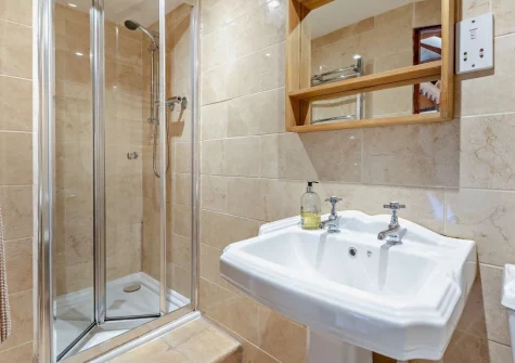 Bedroom #1 en-suite shower room at Woolstone Farmhouse, Box's Shop