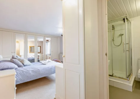 Bedroom #2 & en-suite shower room at Woolstone Farmhouse, Box's Shop