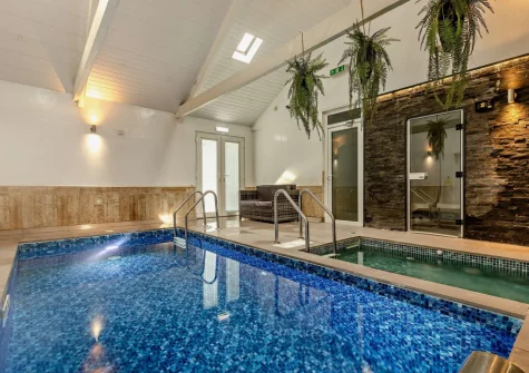 The private indoor swimming pool & hot tub at Woolstone Farmhouse, Box's Shop