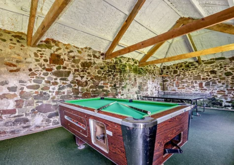 The shared games room at Woolstone Farmhouse, Box's Shop
