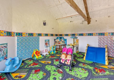 The shared toddler's play room at Woolstone Farmhouse, Box's Shop