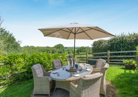 The enclosed garden & alfresco dining area at Woolstone Teagues Trail, Box's Shop