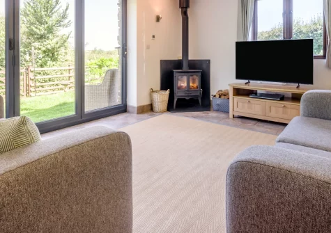 Woolstone Teagues Trail, Box's Shop is a characterful converted barn blending period features with modern comfort, set in peaceful Cornish countryside with shared leisure facilities and just three kilometres from Widemouth Bay's golden sands.