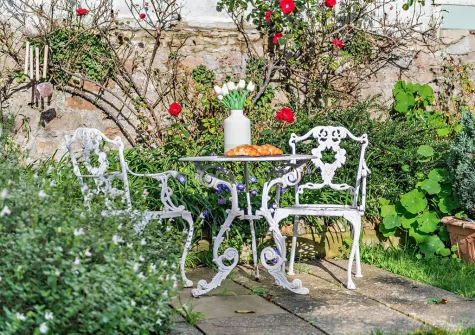 The patio, outdoor sitting area & garden at Wren Cottage, Brixham