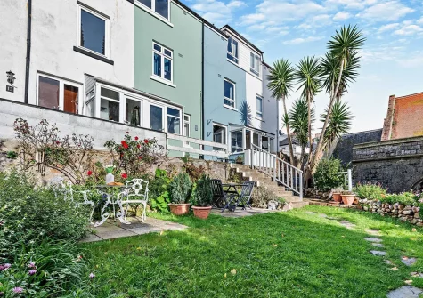 The patio, outdoor sitting area & garden at Wren Cottage, Brixham