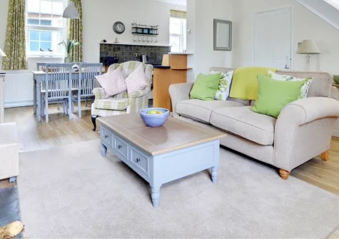 Wykeham, Mortehoe is an elegant Georgian cottage in this enchanting North Devon clifftop village, featuring cosy wood burner warmth, shared gardens with children's play area, and Grunta Beach just 500 metres from your door for seaside adventures.