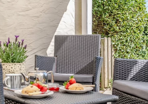 The covered patio & outdoor sitting area at Zona, Pensilva